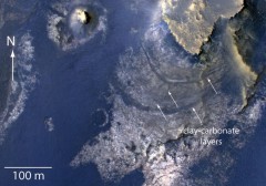 Covering an area of about a third of a mile, this view from MRO's High Resolution Imaging Science Instrument (HiRISE) reveals evidence of clays and carbonate minerals. This has led to increased speculation that McLaughlin may have supported a huge lake in Mars' distant past. Photo Credit: NASA/Jet Propulsion Laboratory  