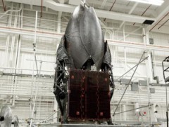 The insect-like appearance of TDRS-K - here seen during final assembly and testing - is exaggerated by its cupped antennas, solar arrays and other appendages. Photo Credit: Boeing 