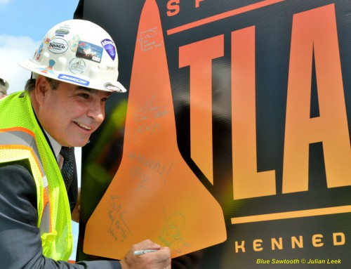 The Kennedy Space Center Visitor Complex Director of Project Development and Construction, Tim Macy, places his signature on Atlantis' new sign. Photo Credit: Julian Leek / Blue Sawtooth Studio