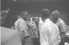 Flight Director Chris Kraft (facing camera) in discussion with John Glenn (right) and Gus Grissom (left). Photo Credit: NASA