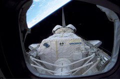 Pictured from Columbia’s aft flight deck, this view shows the payload bay and Spacehab research double module. The grey-colored Reinforced Carbon Carbon (RCC) panels lining the leading edges of the wings can clearly be seen, but the Panel 8/9 junction on the left wing (to the right of this image) is out of sight. Investigators would later conclude that a hole had been punched through the RCC during ascent. Photo Credit: NASA