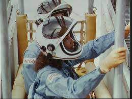 STS-41D astronaut Judy Resnik rehearses procedures for operating the slidewire baskets on Pad 39A. Such procedures would be followed in the event of an evacuation from the orbiter. Photo Credit: NASA