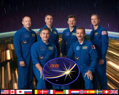 The delivery of the Soyuz TMA-08M crew to the International Space Station returns the orbital outpost to six-person capability. Seated are Pavel Vinogradov (left) and Chris Hadfield, with Aleksandr Misurkin, Chris Cassidy, Roman Romanenko and Tom Marshburn standing. Photo Credit: NASA