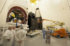 The SBIRS GEO-2 spacecraft is encapsulated within its two-piece ('bisector') payload fairing, ahead of stacking atop the Atlas V 401 for today's launch. Photo Credit: U.S. Air Force