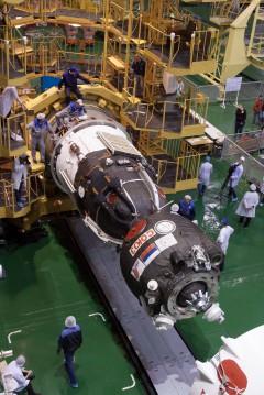 The Soyuz TMA-08M spacecraft, shown here during final closeout activities at Baikonur, will deliver Vinogradov, Misurkin and Cassidy to the space station just six hours after launch. Photo Credit: NASA