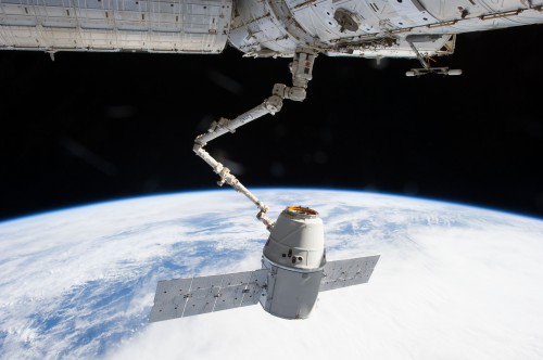 Expedition 34 Commander Kevin Ford grapples the CRS-2 Dragon craft on 3 March with the 57-foot-long Canadarm2. The unpressurized Trunk - with attached solar arrays - carried its first dedicated ISS payload to orbit on this mission. Photo Credit: NASA
