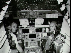 Pictured on the flight deck of the Shuttle mission simulator are STS-3 Commander Jack Lousma (left) and Pilot Gordon Fullerton. Photo Credit: NASA