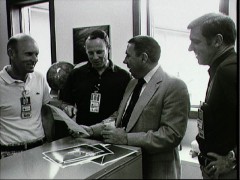 Director of Flight Crew Operations George Abbey (in suit) and STS-2 Commander Joe Engle (right) discuss the successful mission with Gordon Fullerton (left) and Jack Lousma after Columbia's return. Photo Credit: NASA