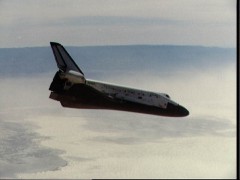 Like a flying brick, Columbia descends towards White Sands on 30 March 1982. This view was acquired from one of the NASA T-38 jets, flying chase that morning. Photo Credit: NASA