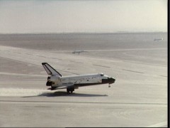 Seconds before Jack Lousma's wheelie, Columbia settles her main gear onto Runway 17 at White Sands. Photo Credit: NASA
