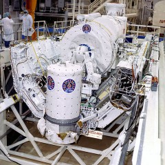 Pictured in 1990, during processing for its long-delayed mission, the ASTRO-1 payload was attached to an Instrument Pointing System (IPS), which would guide its telescopes to their targets. Photo Credit: NASA
