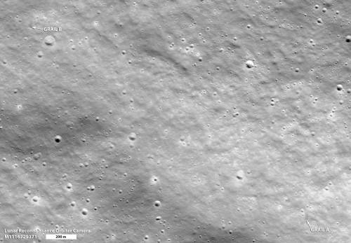 In this image, both of the impact sites of the mirror-image GRAIL spacecraft can be seen. The final resting spots of these two spacecraft were imaged by the Lunar Reconnaissance Orbiter. Image Credit: NASA/GSFC/Arizona State University