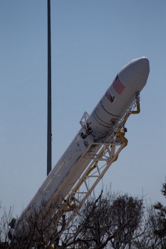 Orbital's first Antares rocket is raised to the vertical position by the Transporter Erector Launcher (TEL) at Pad 0A on 6 April 2013. Photo Credit: NASA/Wallops/Brea Reeves