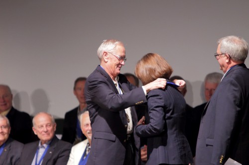 Apollo 16 Moonwalker Charlie Duke presents 2013 Astronaut Hall of Fame inductee with her medal, marking her as one of the latest  members of this elite club. Photo Credit: Alan Walters / awaltersphoto.com