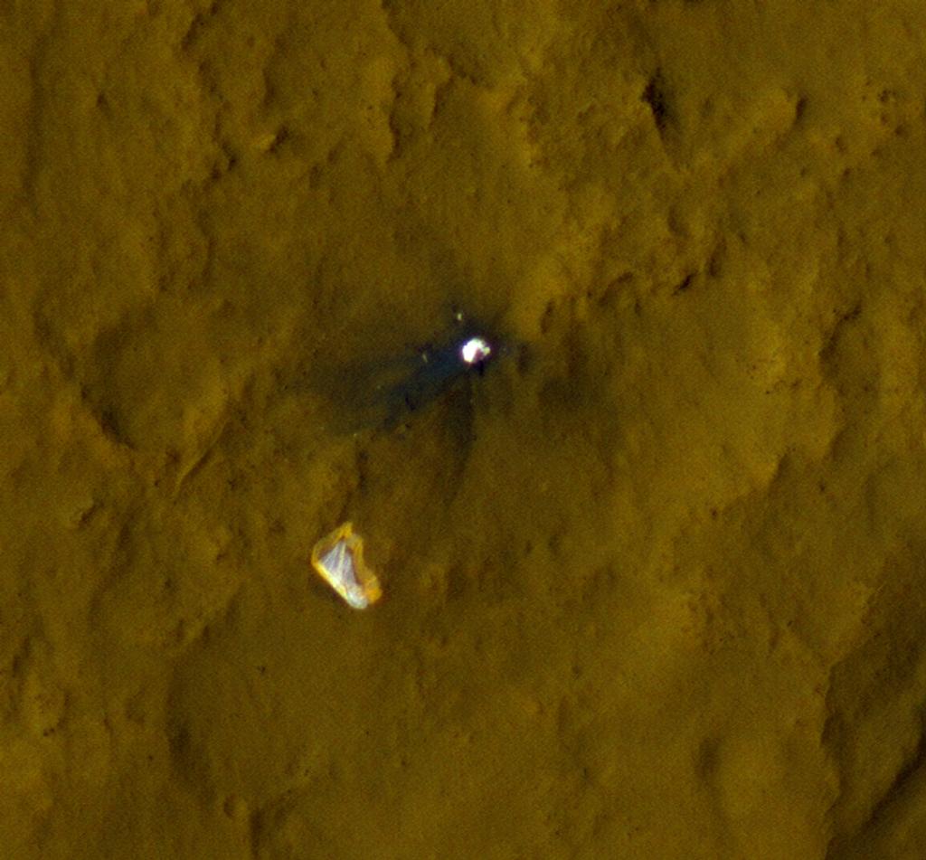 NASA has compiled a series of images taken by the Mars Reconnaissance Orbiter's HiRISE camera to show Curiosity's used parachute flapping in the Martian wind. Image Credit: NASA/JPL-Caltech/Univ. of Arizona 