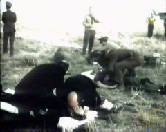 In a particularly harrowing image, would-be rescuers offer initial support to the bearded Georgi Dobrovolski. Little did they know at the time that all three men had been dead for far too long for resuscitation to have any positive effect. Photo Credit: Joachim Becker/SpaceFacts