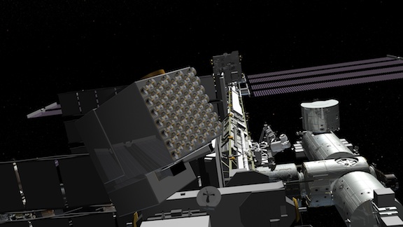 The cube-shaped NICER instrument, with its expansive array of 56 telescopes, is shown in this depiction at work on the International Space Station. Image Credit: NASA