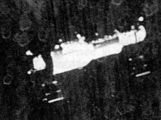 Grainy image from the departing Soyuz 11 mission in June 1971, showing Salyut 1. This was one of the last close-up views of the world's first space station. Photo Credit: Roscosmos