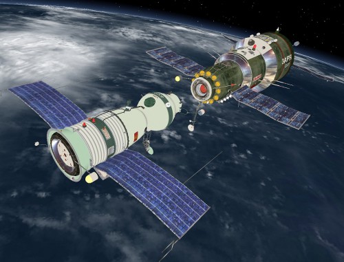 Artist's concept of the Soyuz 11 spacecraft (left) during joint operations with Salyut 1. Image Credit: Joachim Becker/SpaceFacts