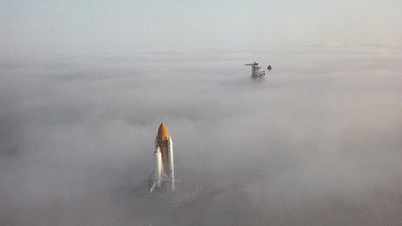 Challenger rolls in gloomy midwinter fog towards Pad 39A on 30 November 1982. Photo Credit: NASA