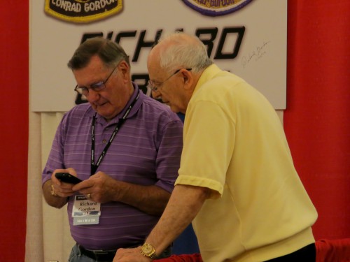 Apollo 12's Dick Gordon and Alan Bean review a text on Gordon's phone. Photo Credit: Mark Usciak / AmericaSpace