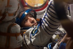 Luca Parmitano reaches for controls during a Soyuz simulation. The six-hour "fast rendezvous" profile was adopted for piloted missions as a means of reducing the negative physiological effects of operating within the cramped Soyuz. Photo Credit: NASA
