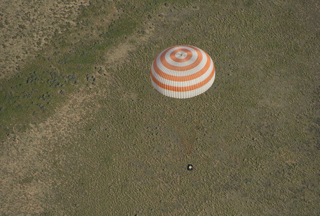Carrying Canada's first ISS Commander, Chris Hadfield, together with Russian cosmonaut Roman Romanenko and NASA astronaut Tom Marshburn, Soyuz TMA-07M descends toward a touchdown in central Kazakhstan after 146 days in orbit. Photo Credit: NASA