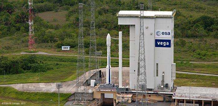 Arianespace's Vega VV-02 stands ready at the Guiana Space Center in Kourou, primed for Friday night's scheduled liftoff. Photo Credit: Arianespace