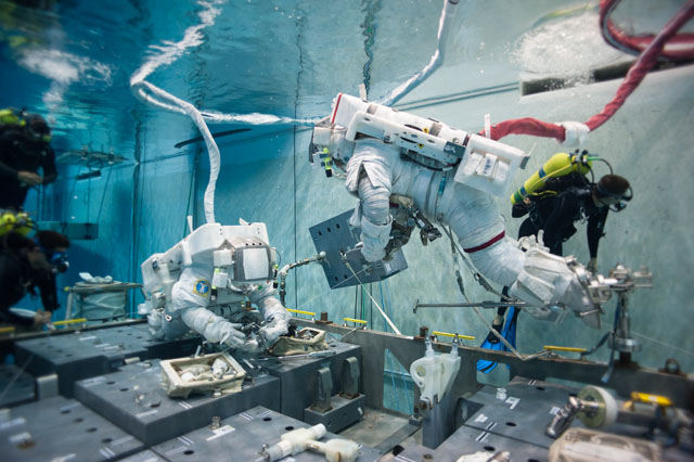 Pictured in the Neutral Buoyancy Laboratory, astronauts Terry Virts (right) and Samantha Cristoforetti practice techniques for today's EVA. Photo Credit: NASA