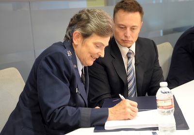 Lt. Gen. Ellen Pawlikowski, commander of SMC, and SpaceX CEO Elon Musk signing the CRADA Photo Credit U.S. Air Force Joe Juarez posted on AmericaSpace