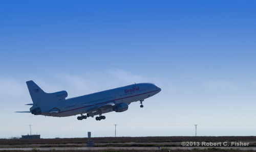 The Lockheed L-1011 aircraft departs Runway 12/30 at Vandenberg Air Force Base, Calif., at 6:27 p.m. PDT (9:27 p.m. EDT) on 27 June 2013. Almost an hour later, after reaching its required deployment position, Pegasus-XL was air-launched to begin its mission of deploying NASA's IRIS solar observatory. Photo Credit: Robert C. Fisher / AmericaSpace