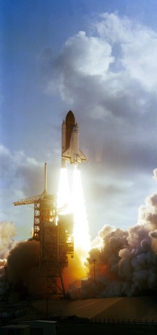 STS-7 roars into orbit, carrying America's first female astronaut and the first five-member crew. Photo Credit: NASA