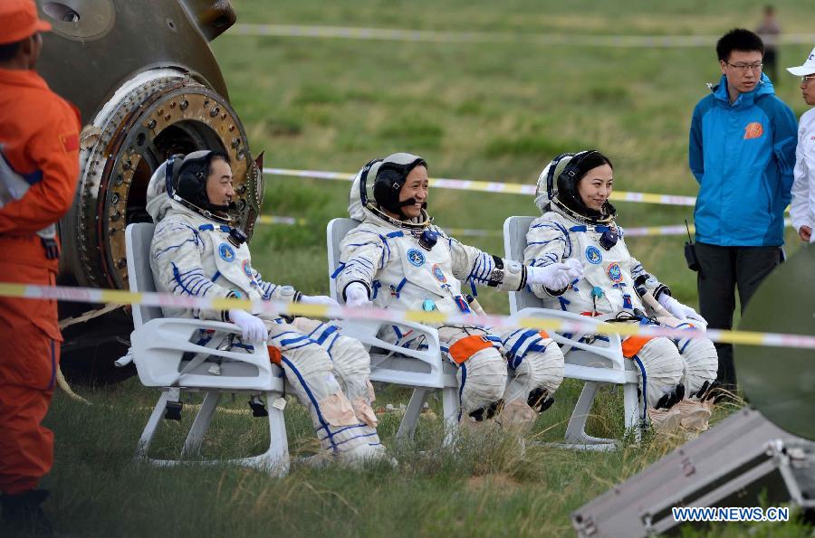 Zhang Xiaoguan, Nie Haisheng and Wang Yaping begin the process of readaptation to terrestrial gravity after 15 days in space. Photo Credit: Xinhua News Agency