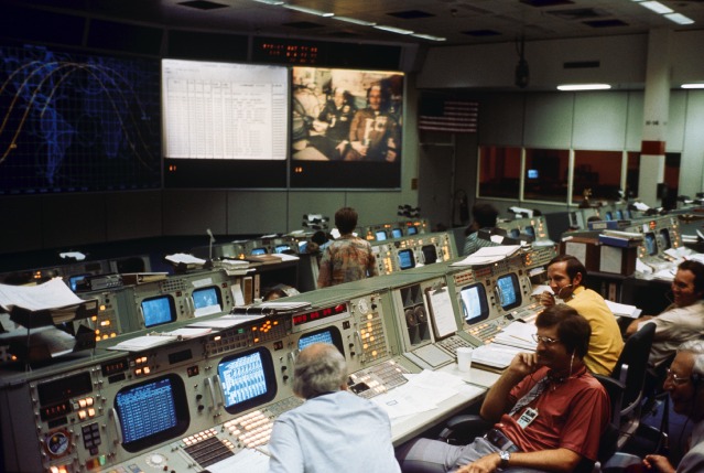 A view of Mission Control at the Johnson Space Center in Houston, Texas, during the joint mission. Flight Director Neil Hutchison can be seen in the foreground, in the red shirt. Photo Credit: NASA