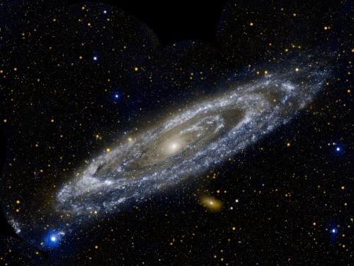 The Andromeda galaxy, M31, observed by the now-retired ultraviolet space telescope GALEX. This composite image is false-colored with blue representing far ultraviolet and orange representing near ultraviolet.