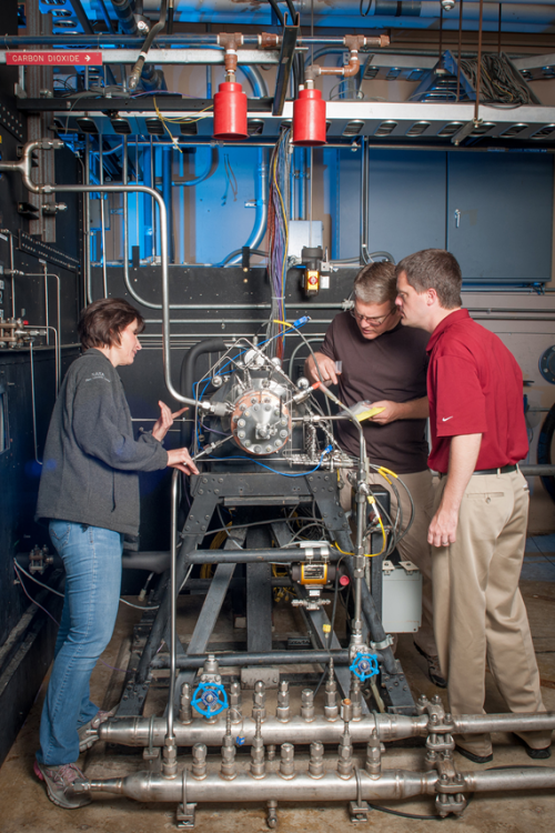 NASA Aerojet Rocketdyne engineers working on 3D printed additively manufactured rocket injectore posted on AmericaSpace