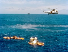 The Apollo command module is surrounded by recovery forces in the minutes after splashdown. Little did anyone realize at this stage that the astronauts had been exposed to a potentially lethal dose of noxious nitrogen tetroxide. Photo Credit: NASA