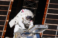STS-134 astronaut Drew Feustel instals MISSE-8 during a spacewalk in May 2011. Note the suitcase-like Passive Experiment Container (PEC) which housed the experiment. Photo Credit: NASA