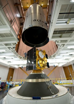 The payload fairing containing Alphasat is lowered into position above Insat-3D during final pre-launch processing. Photo Credit: Arianespace