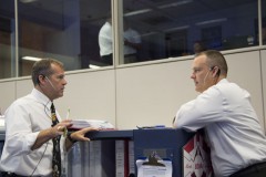 Flight Director David Korth (left) chats with fellow flight director Norm Knight during EVA-23. Photo Credit: NASA