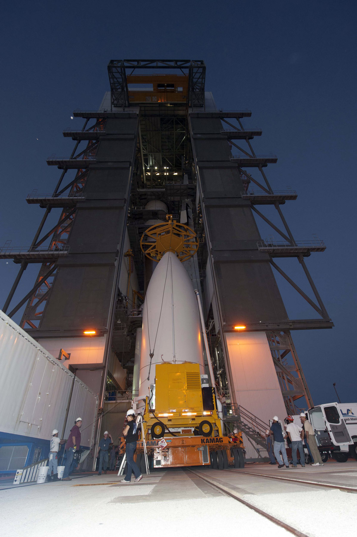 The U.S. Navy’s Mobile User Objective System (MUOS)-2 satellite, encapsulated with its payload fairing, is transferred from the Vertical Integration Facility to SLC-41 and is awaiting Atlas V 551 launch vehicle on 8 July 2013. Photo Credit: United Launch Alliance