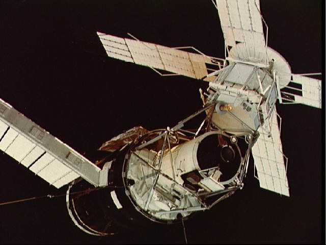 Pictured during the rendezvous procedure, this view clearly shows Skylab's multiple docking adapter, equipped with twin ports to support a visiting craft and a possible rescue craft. Photo Credit: NASA