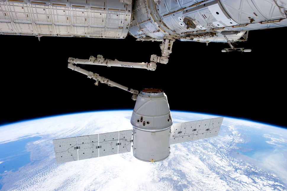 An unmanned Dragon (CRS-2) grappled by the International Space Station. Credit: NASA