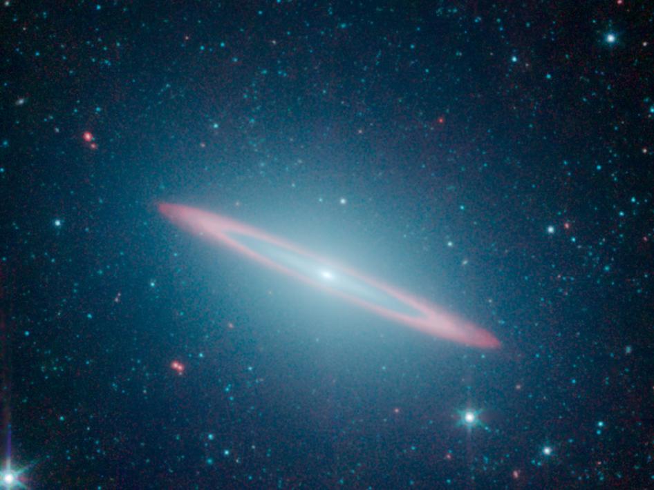 The infrared vision of NASA's Spitzer Space Telescope has revealed that the Sombrero galaxy -- named after its appearance in visible light to a wide-brimmed hat -- is in fact two galaxies in one. Image Credit: NASA/JPL-Caltech