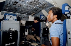 Seated in the flight engineer's position in the simulator, Guy Bluford's prime task during ascent was to assist the pilots with monitoring Challenger's systems. Photo Credit: NASA