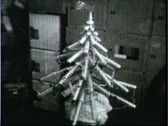The makeshift Christmas tree built by astronauts Carr, Gibson and Pogue from old food containers and packaging also included a long-tailed star at its tip: Comet Kohoutek. Photo Credit: NASA