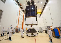 Eutelsat 25B/Es'hail-1 undergoes clean-room fit checks ahead of installation onto the SYLDA payload dispenser for VA-215. Photo Credit: Arianespace
