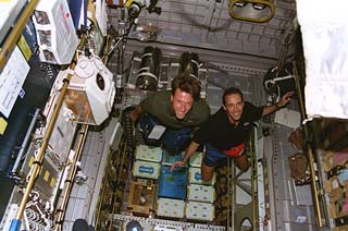 Foale and French astronaut Jean-Francois Clervoy aboard the Spacehab module during STS-84 in May 1997. Photo Credit: NASA