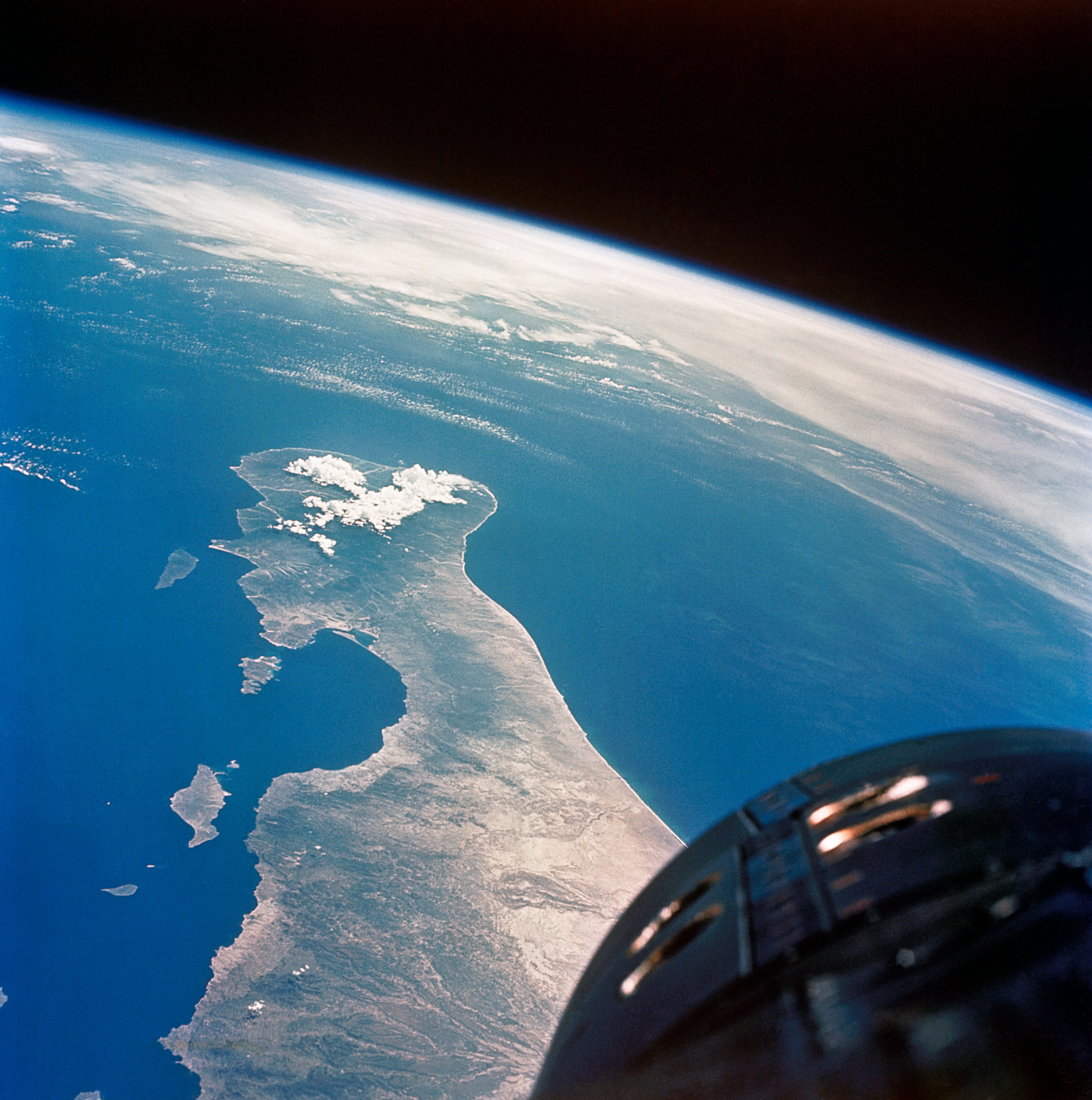 Glorious view of Baja California, with the nose of Gemini V visible at bottom right. Photo Credit: NASA
