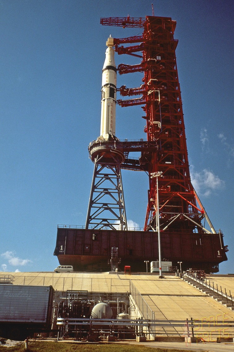 Rollout of the Saturn IB for the Skylab-Rescue (SL-R) mission in August 1973. Pad 39B was originally designed for the large Saturn V and the smaller Saturn IB required a "milk stool" to elevate it to the proper level to access the gantry's utilities and umbilicals. Photo Credit: NASA